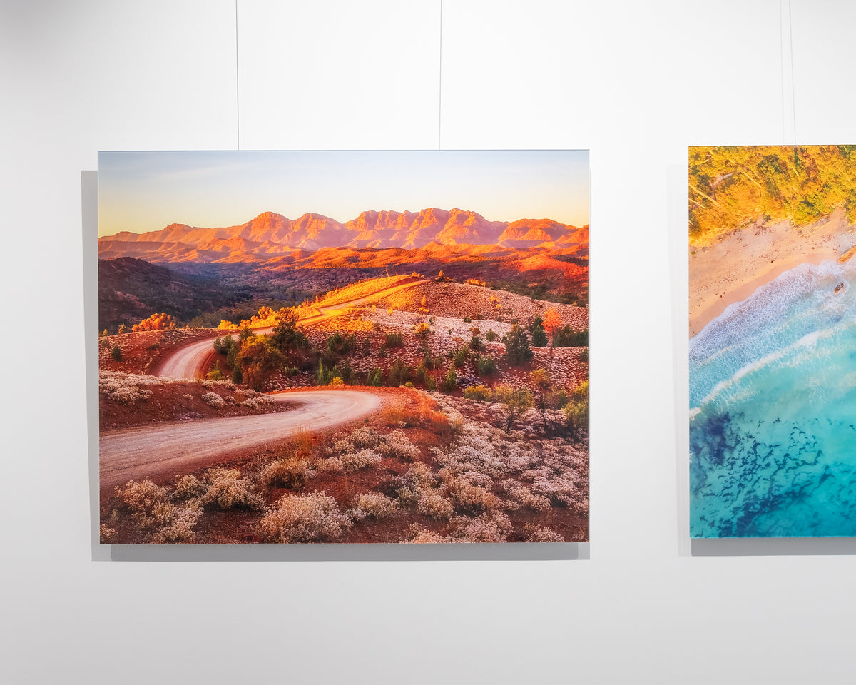 Razorback Ridge. Sunrise over Wilpena Pound, Flinders Ranges, South Australia, frameless acrylic on display in gallery.