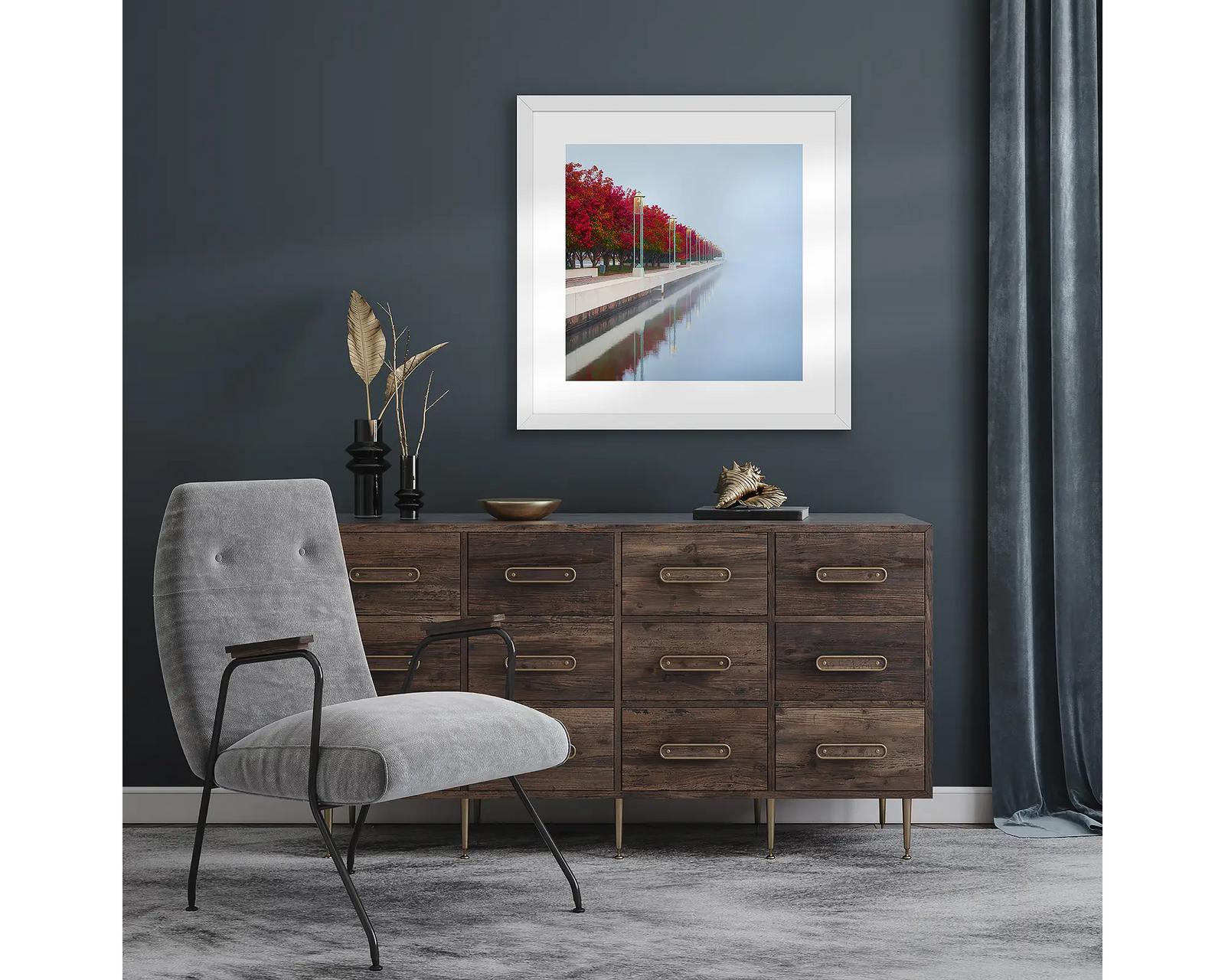 Framed landscape photograph of red autumn trees on a misty lake.
