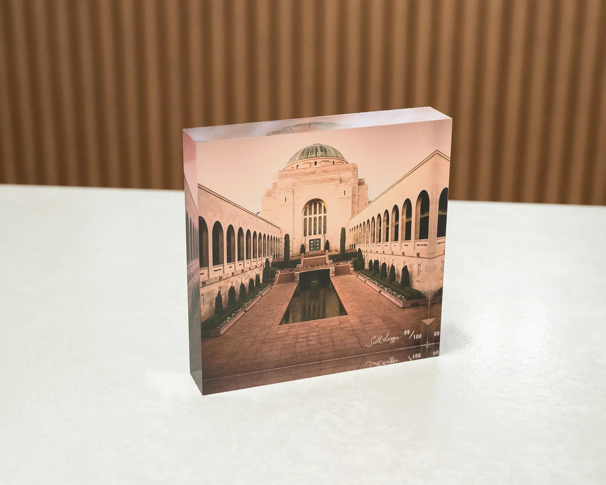 Remembrance. Acrylic block of the Australian War Memorial Canberra, sitting on a desk.