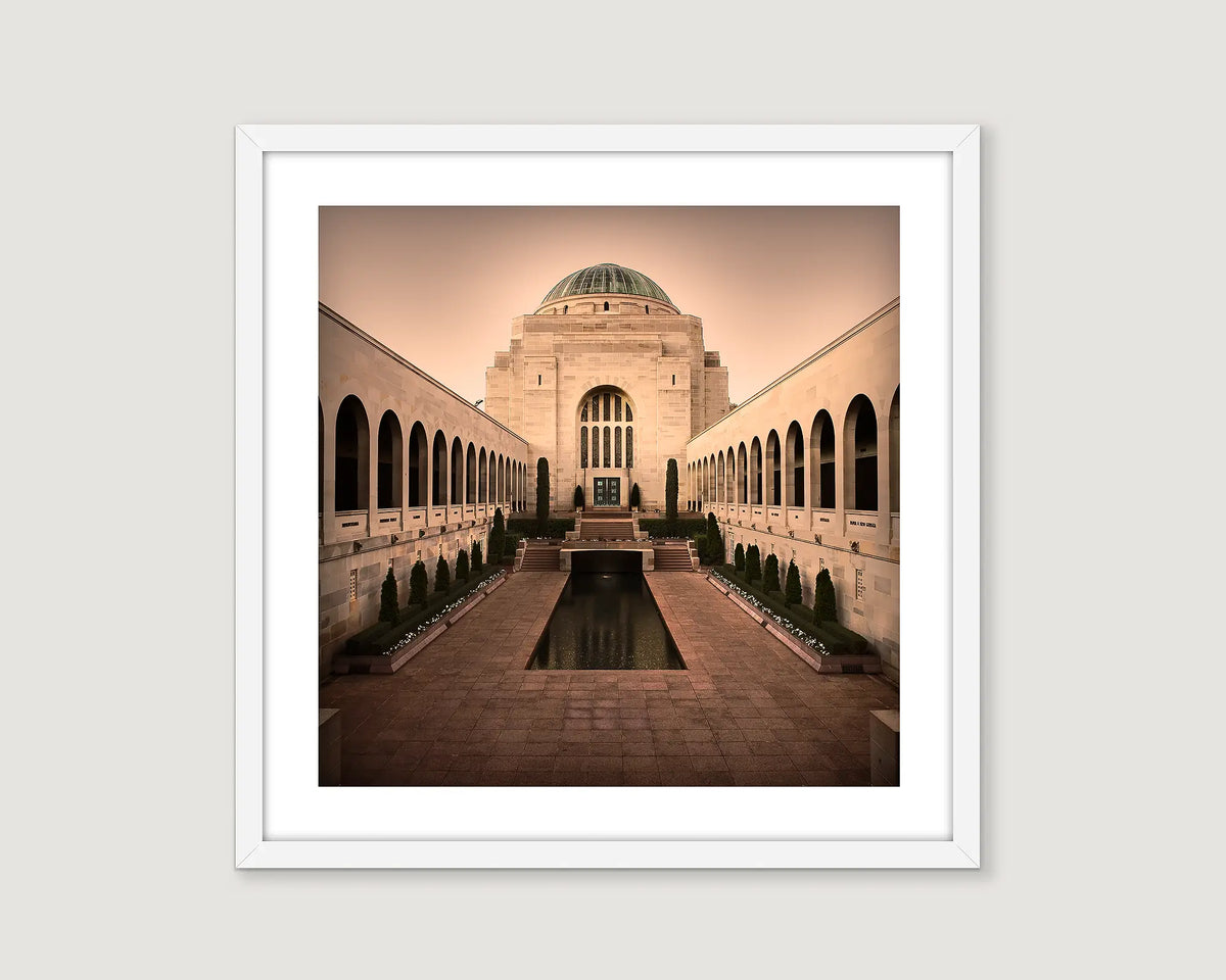 Framed photograph of the Australian War Memorial and Pool of Reflection in sepia tones.