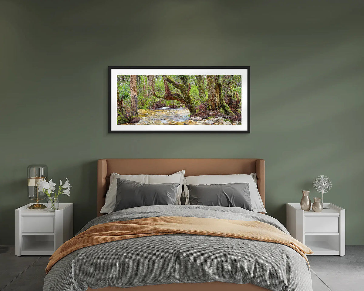 Reverie. Cradle Mountain Lake St Clair wall art print framed with a black frame, hung on a bedroom wall. 