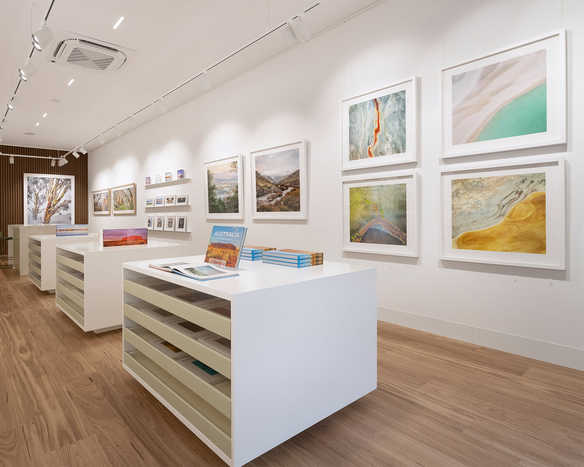 Ripples. Whitehaven Beach, Queensland, aerial artwork with white frame, showcased in gallery.