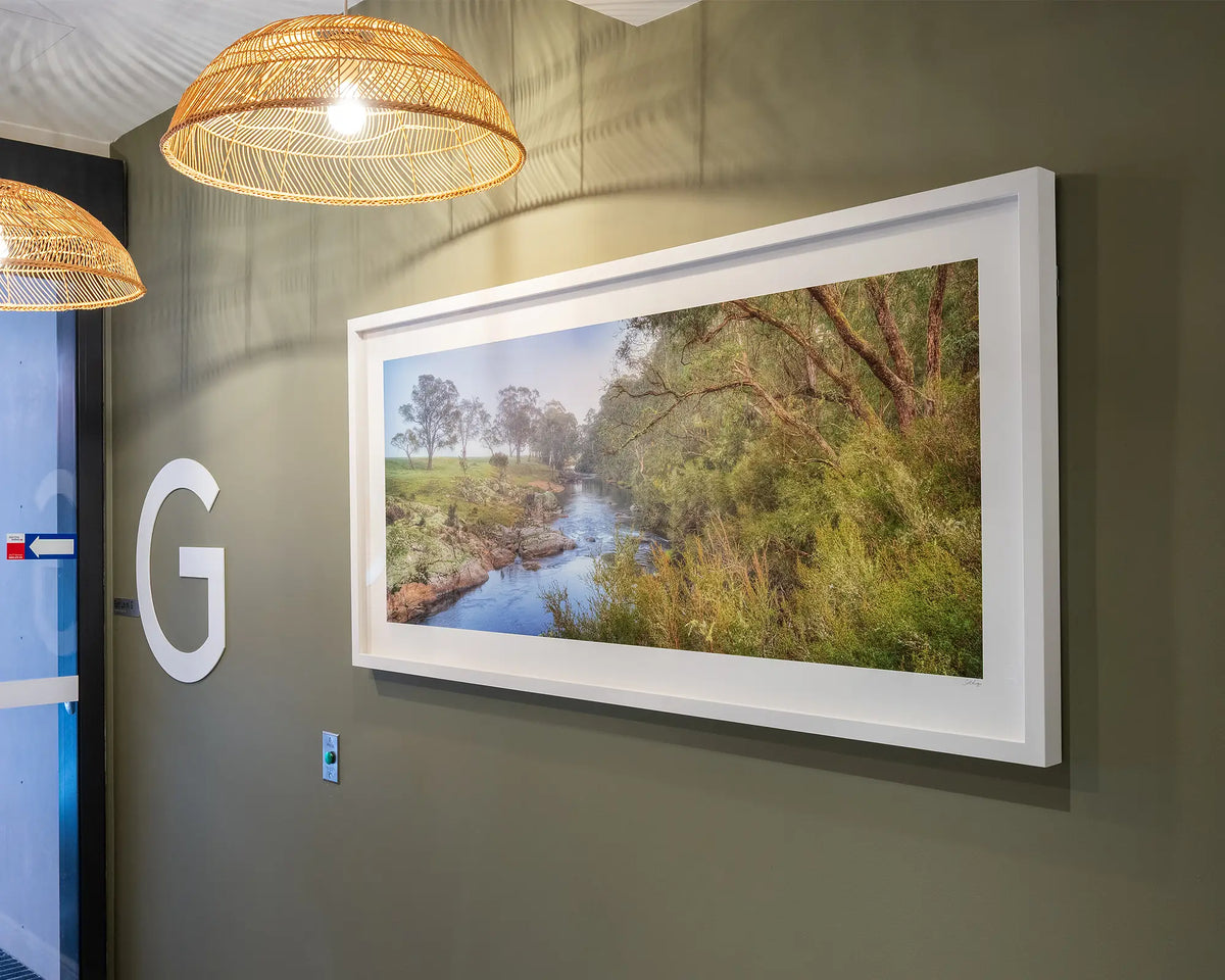 Riverside Veil. Murray River, New South Wales, with white frame on olive green wall, ground floor entrance of commercial space.