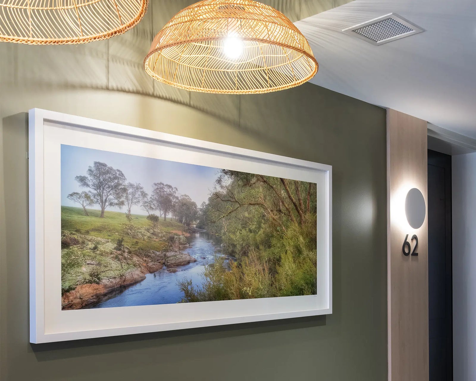 Framed artwork of a landscape with the Murray River, trees, and greenery.