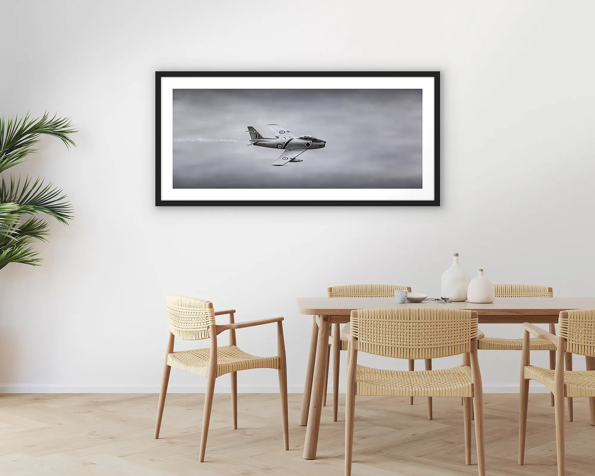 Sabre. Photographic aviation wall art print with a black frame, hung in a dining room. 