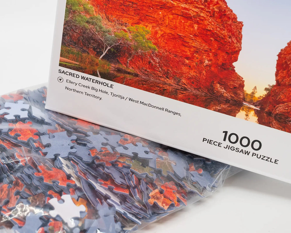 Sacred Waterhole. 1000 piece open jigsaw puzzle showing puzzle pieces, West Macdonnell Ranges, Northern Territory.