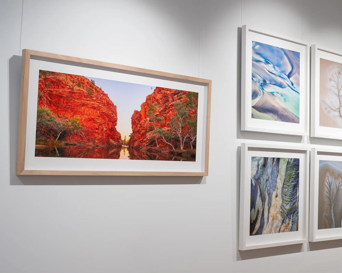 Sacred Waterhole. Ellery Creek Big Hole, Northern Territory at sunset, with timber frame hung on gallery wall.