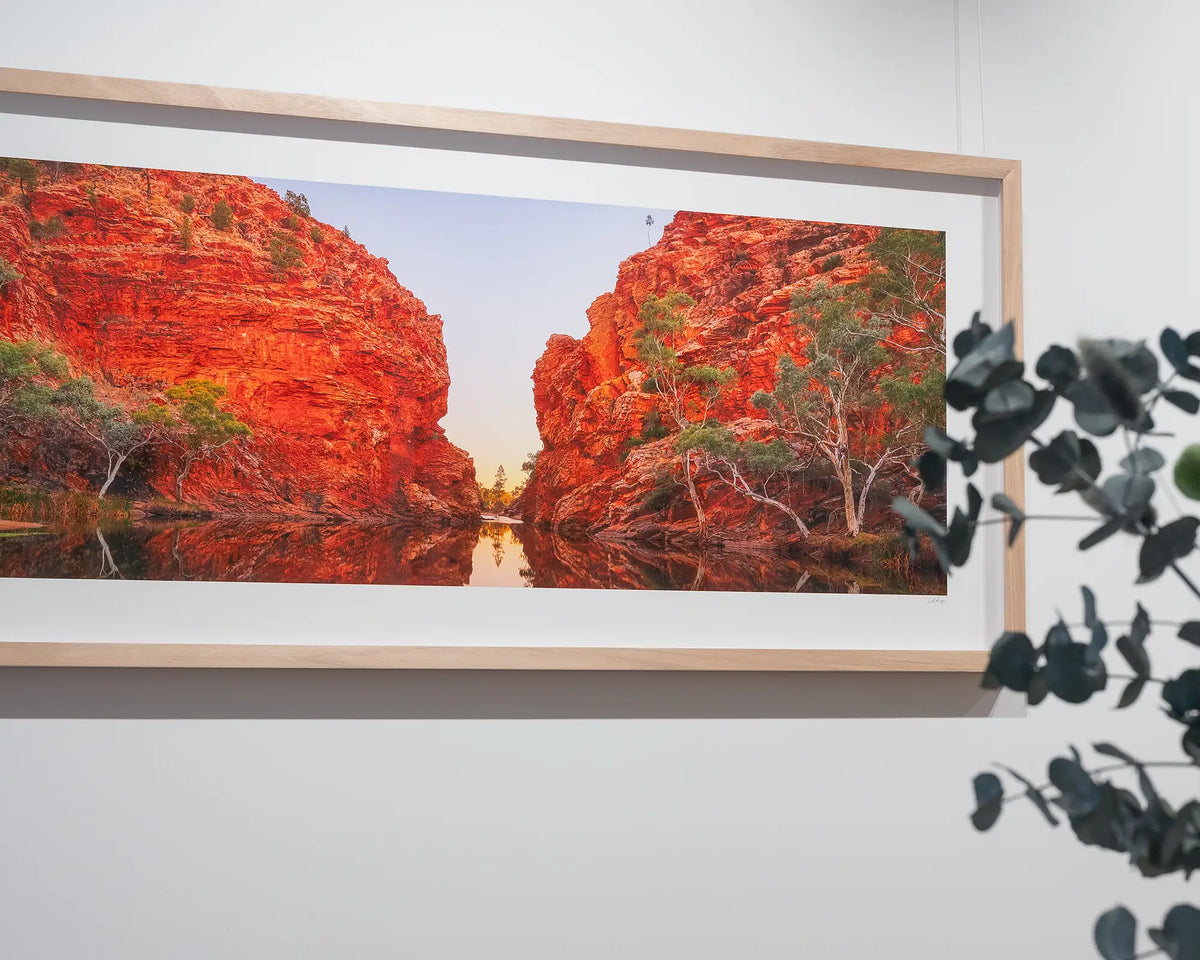 Sacred Waterhole. Ellery Creek Northern Territory, with timber frame, in gallery with natives in foreground.