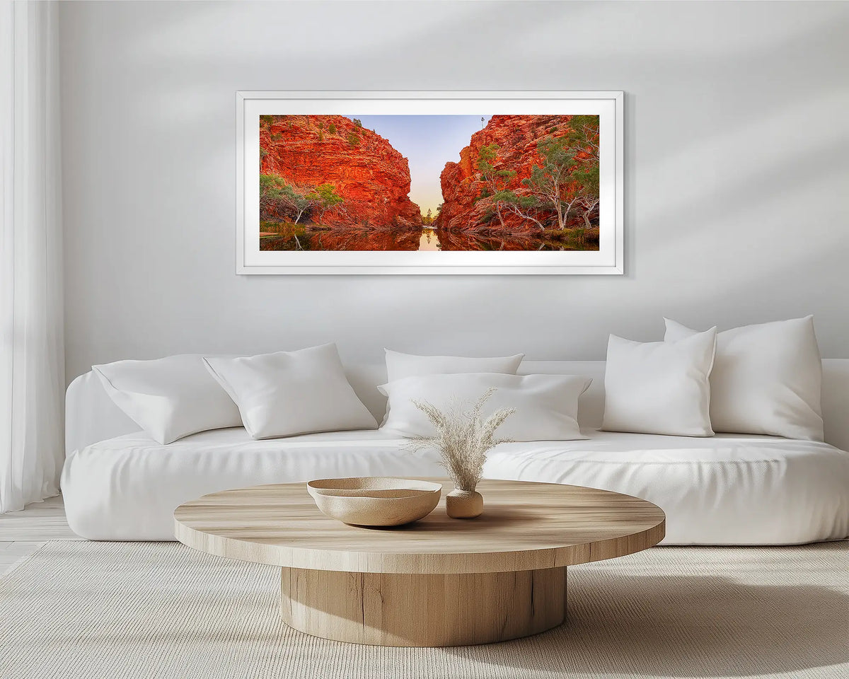 Sacred Waterhole. White framed, outback wall art print, hung in a scandi-themed lounge room.