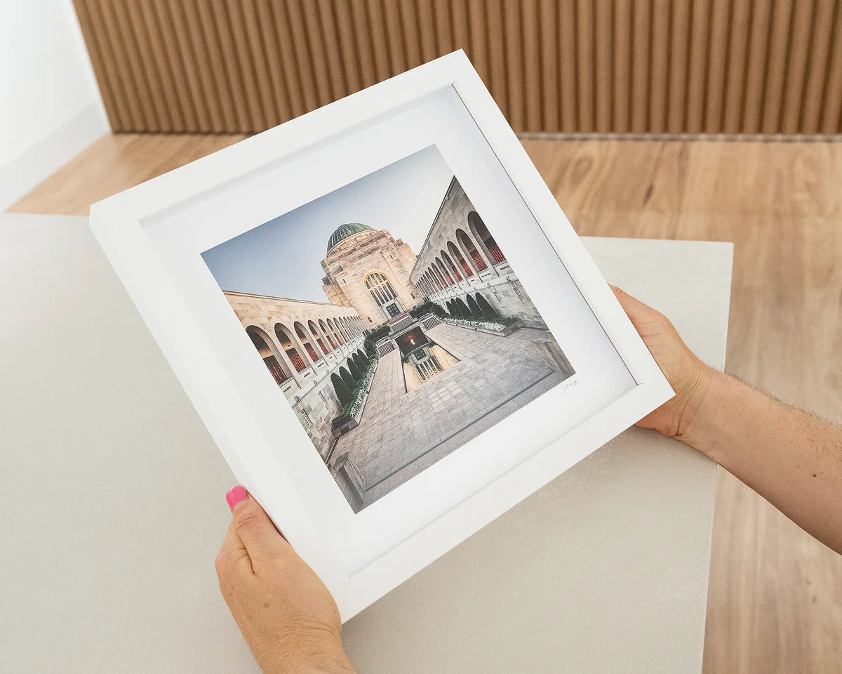 Sacrifice. Australian War Memorial Canberra with white frame being hand held.