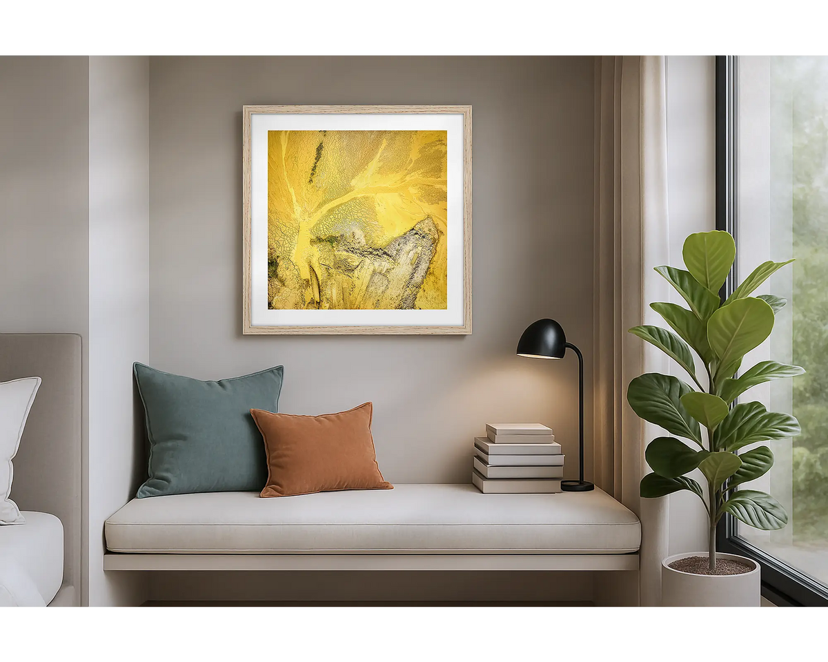 Sand Mining. Wall art print of a mining site viewed from above, with a Tassie Oak frame, hung in an apartment. 