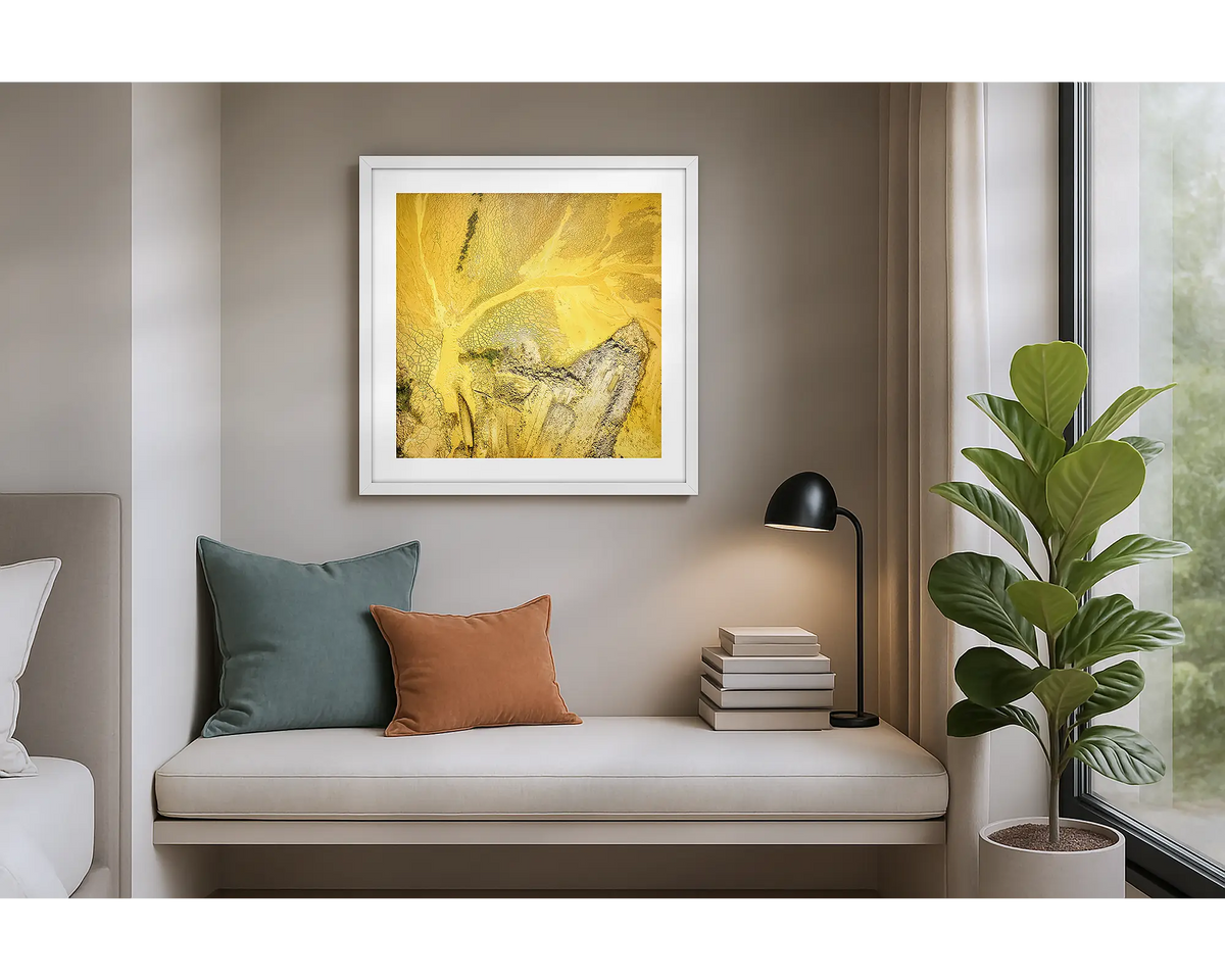 Sand Mining. Wall art print of a mining site viewed from above, with a white frame, hung in an apartment. 