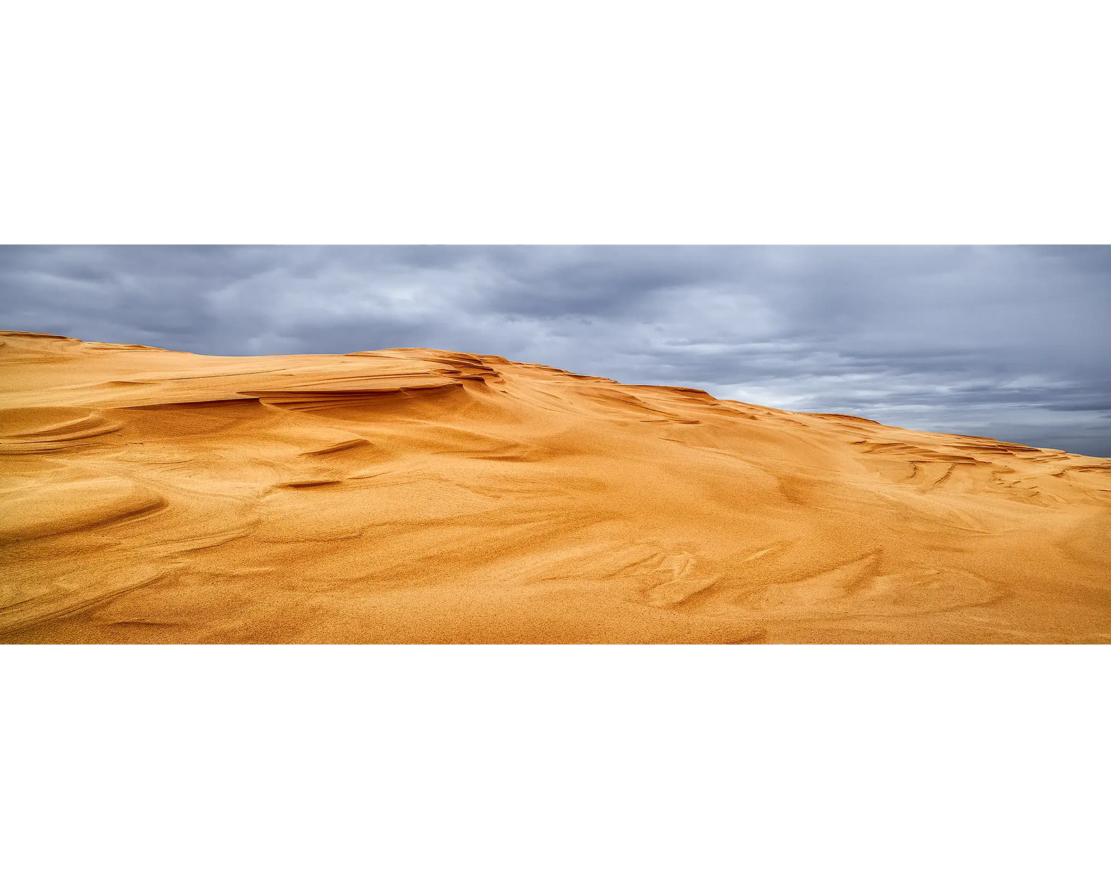 Storm clouds over sand dunes at Stockton Beach, NSW. 