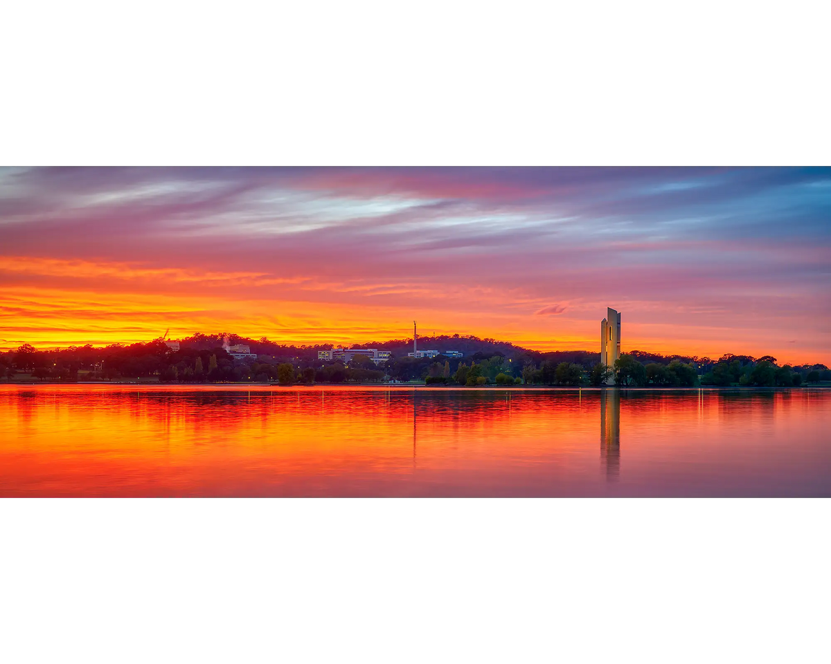 Scarlet sunrise over Rusell Office and Lake Burley Griffin in Canberra.