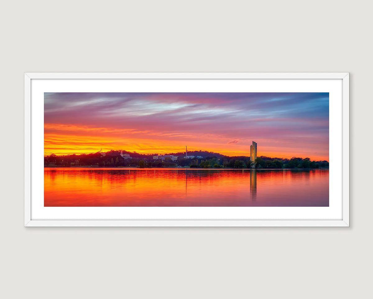 Framed photograph of a red sunset over Lake Burley Griffin and the Carillon.