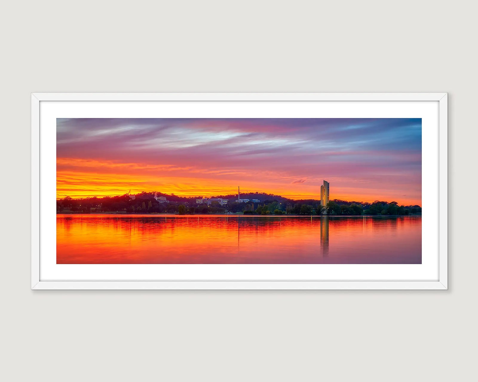 Framed photograph of a red sunset over Lake Burley Griffin and the Carillon.