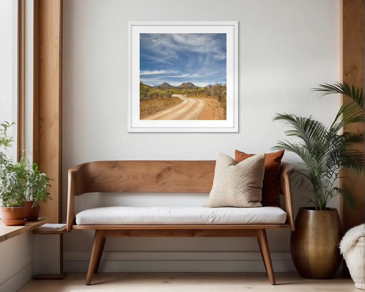 Scenic Drive. White framed wall art print of Flinders Ranges, hung in a scandi-themed waiting area.