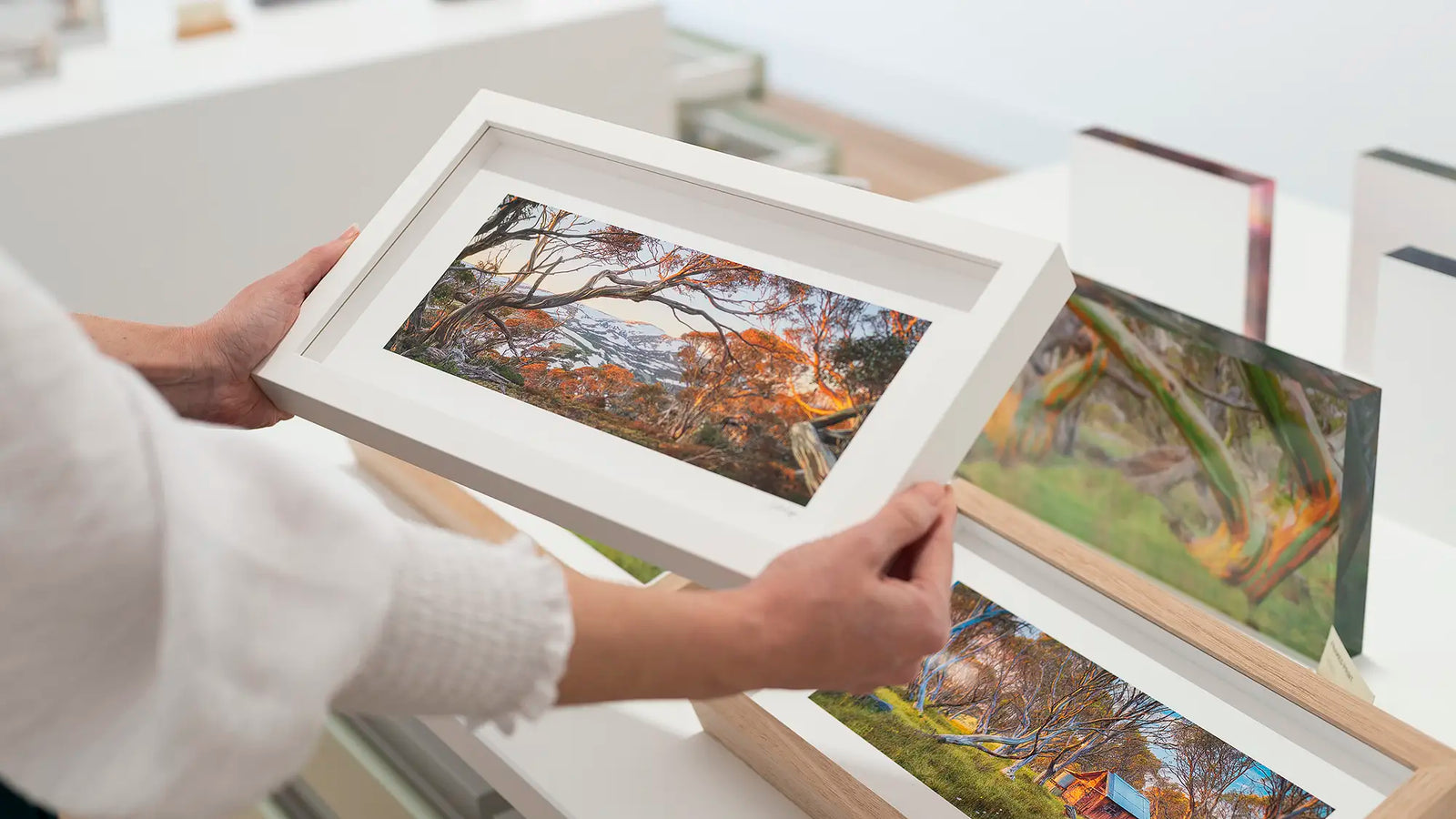 Scott Leggo small framed print, corporate gift being held.