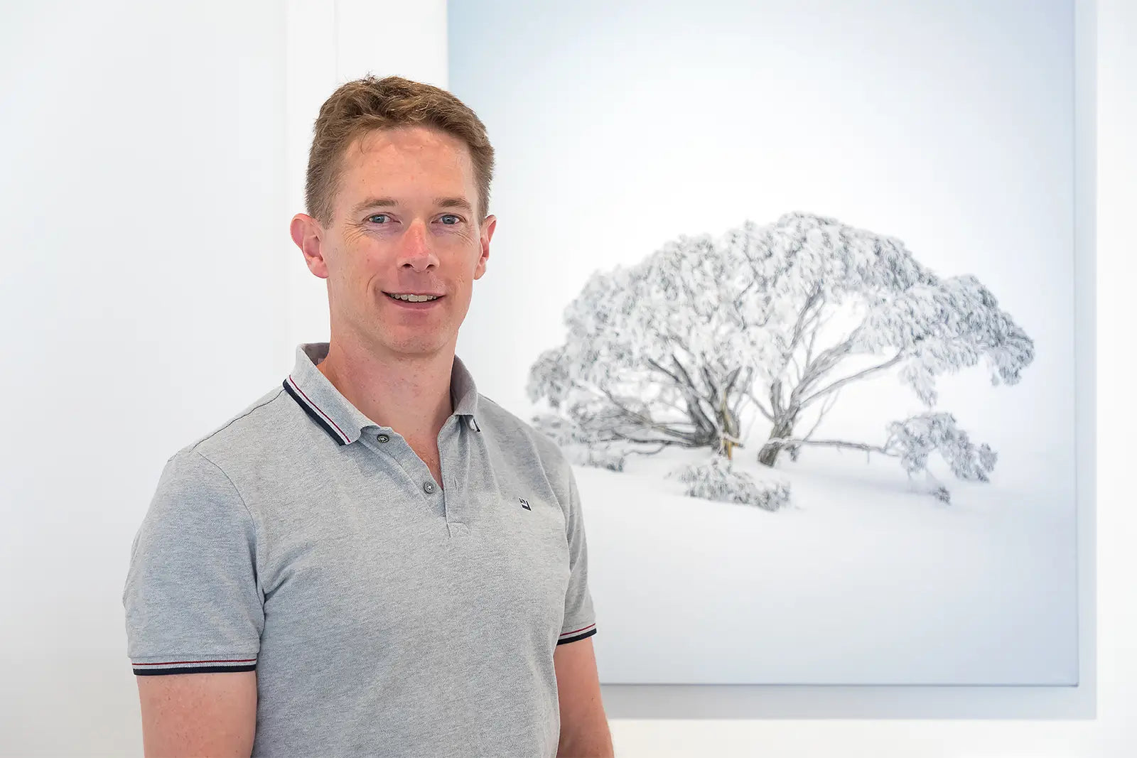 Scott Leggo standing in fromt of his sno artwork titled Chilled.