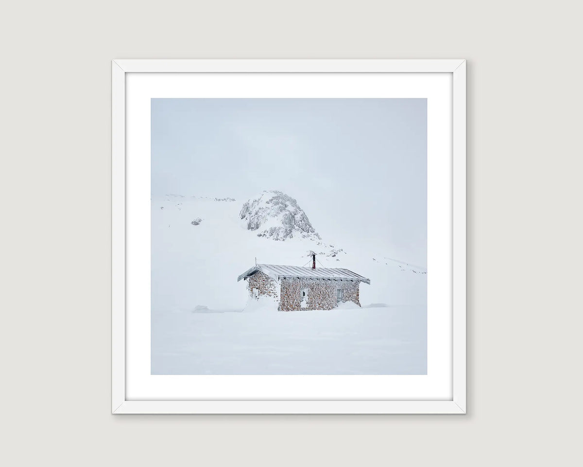 Framed artwork of a snowy landscape with Seaman's Hut.