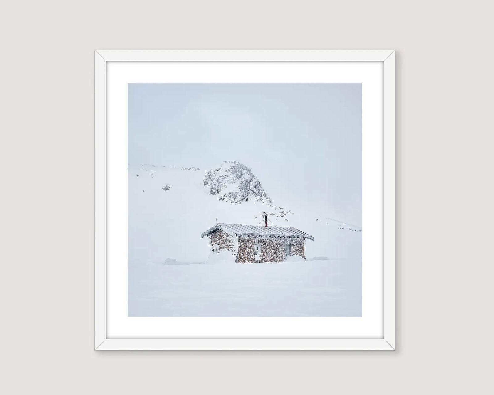 Framed artwork of a snowy landscape with Seaman's Hut.