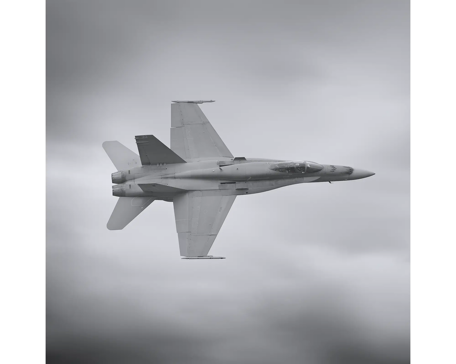 Royal Australian Air Force F/A-18 Hornet, 75 squadron, flying through clouds. 