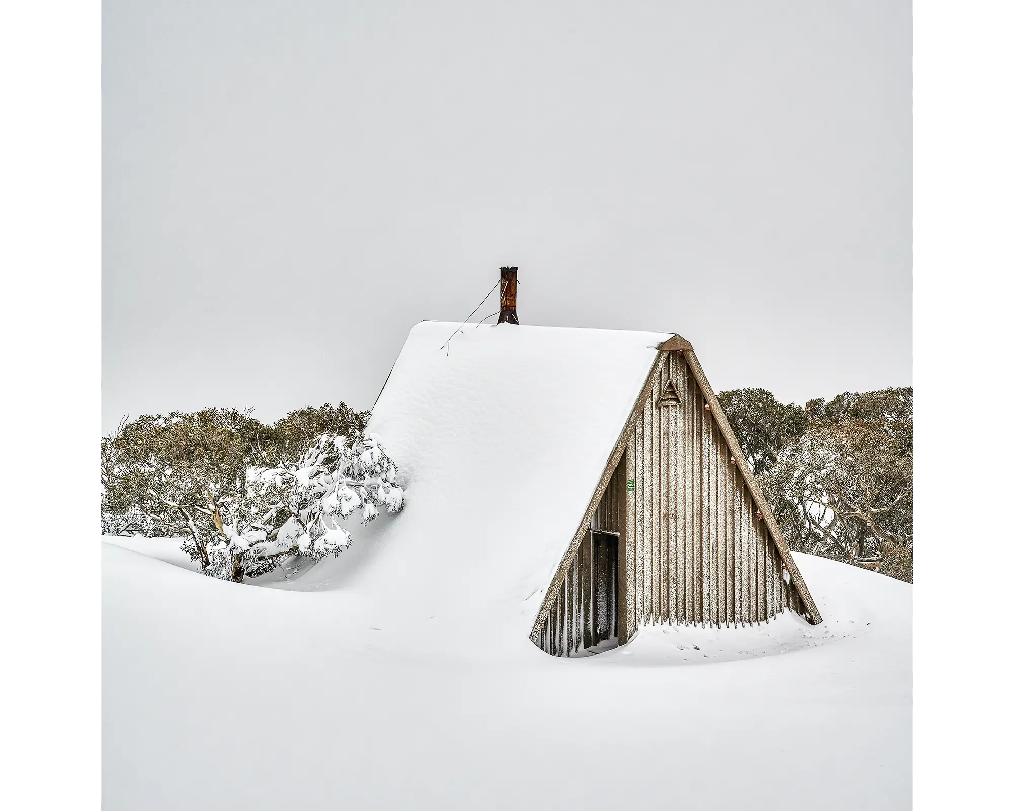 Diamantina Hut covered in snow on Mount Hotham.