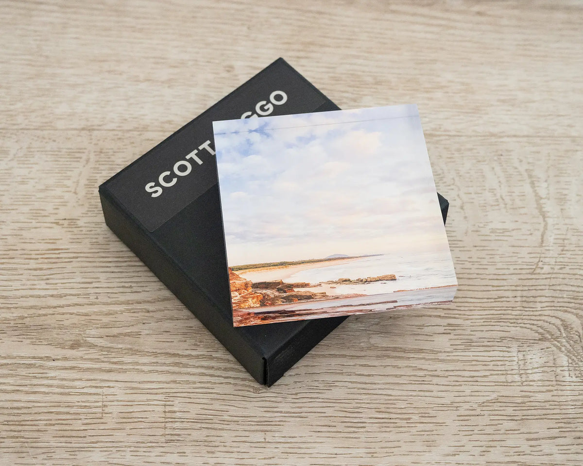 Shoreline. Acrylic block of Mudjimba Beach, Sunshine Coast, Queensland, laying flat on a gift box.