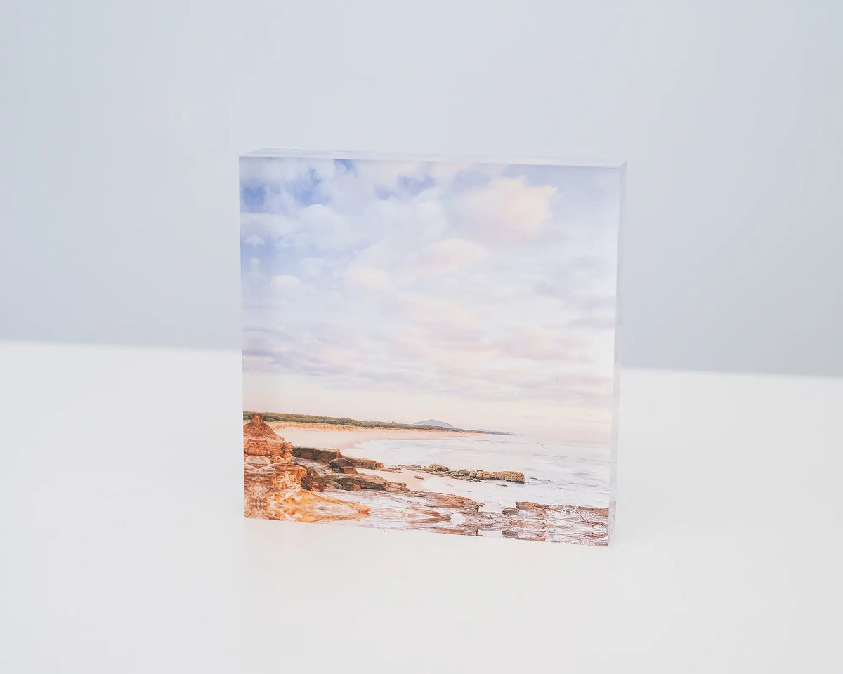 Shoreline. Acrylic block of Mudjimba Beach, Sunshine Coast, Queensland, sitting on a desk.
