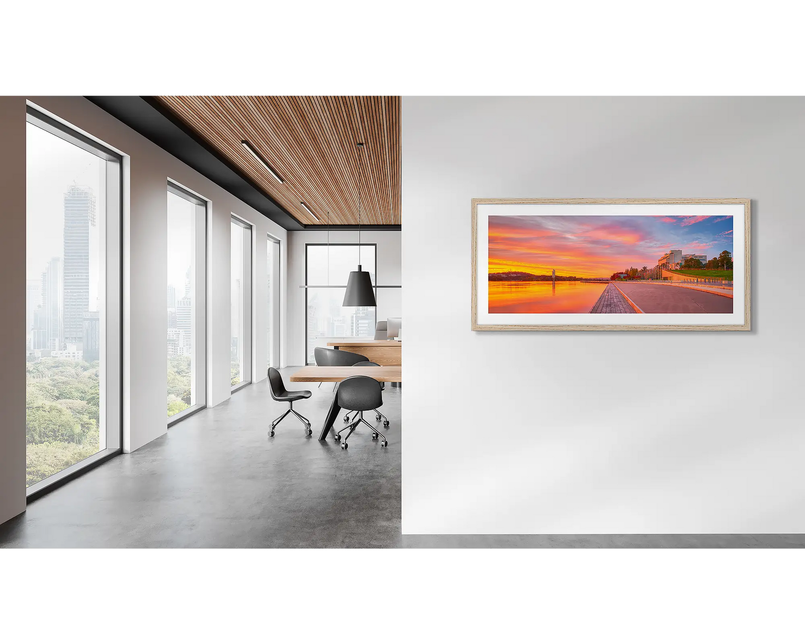 Framed photograph of a sunset over Lake Burley Griffin with the Carillon and High Court in the background.