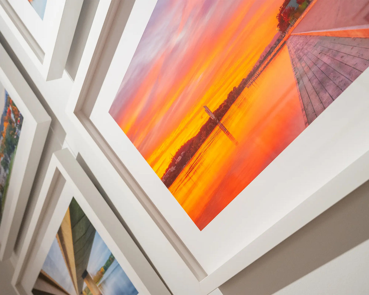 Sky Light. Lakeside sunrise wall art with white frame hung in the gallery with Canberra collection.