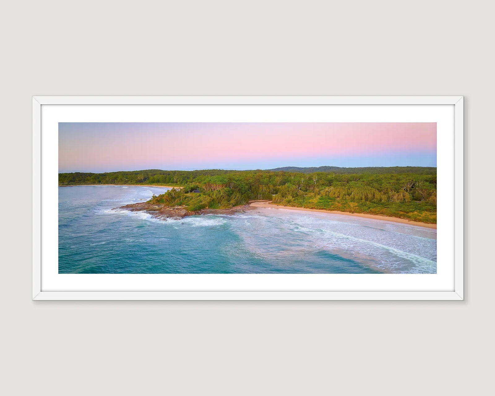 Framed artwork of the coastal landscape of Durras Beach with greenery and water.