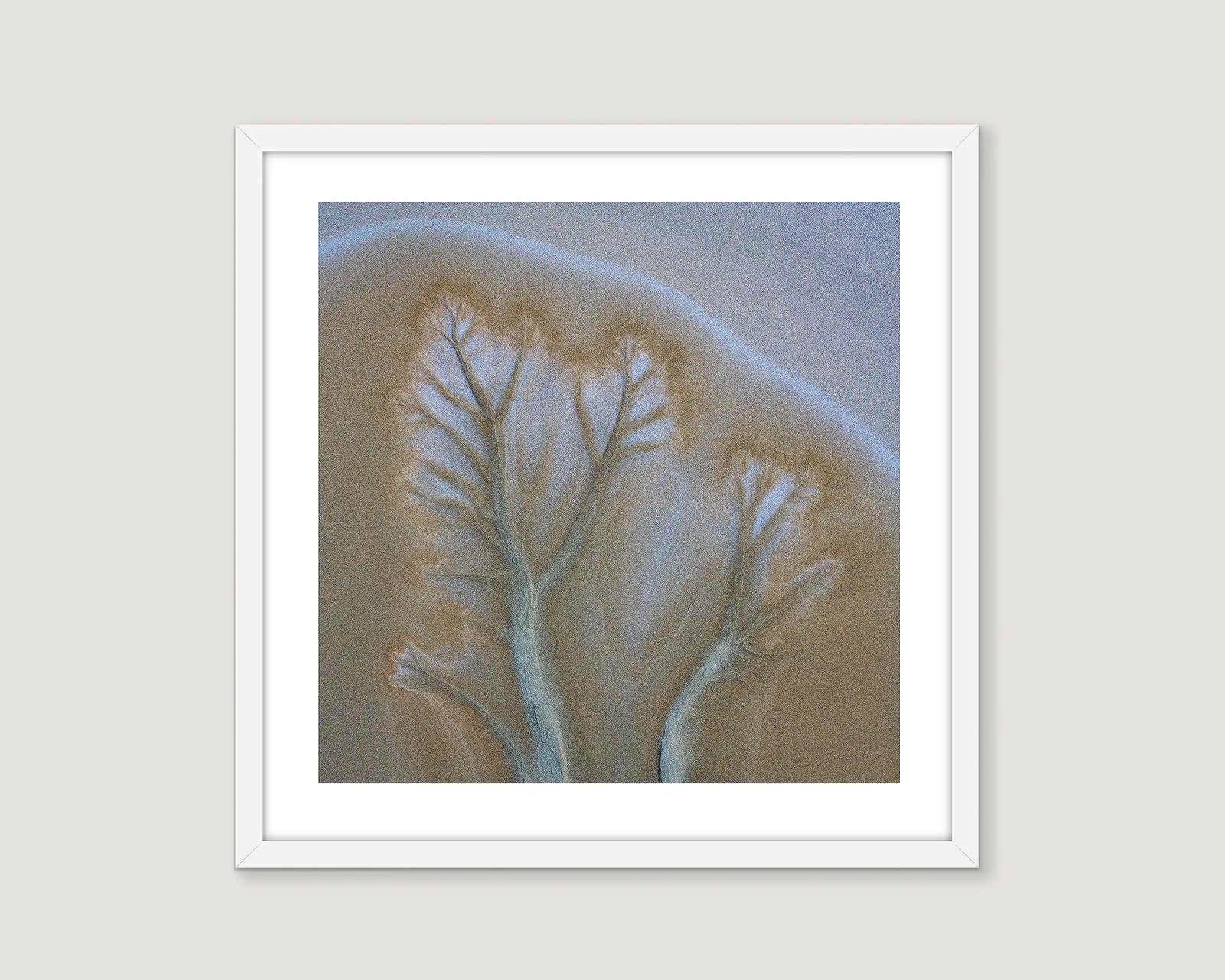 Framed abstract artwork of a textured beige and grey pattern.