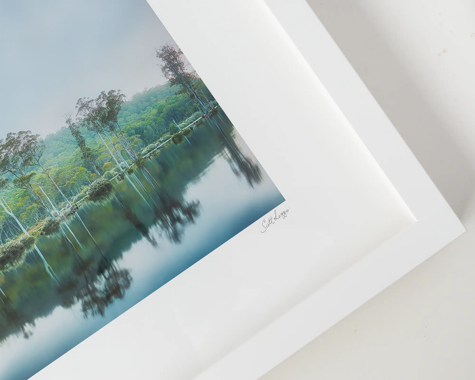 Framed landscape artwork of the Franklin Gordon River with trees and water.