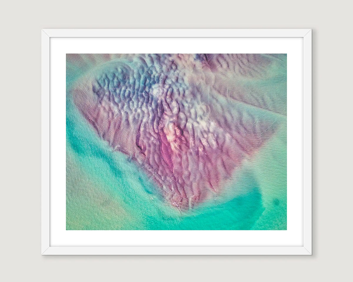 White framed artwork with a colourful abstract design.