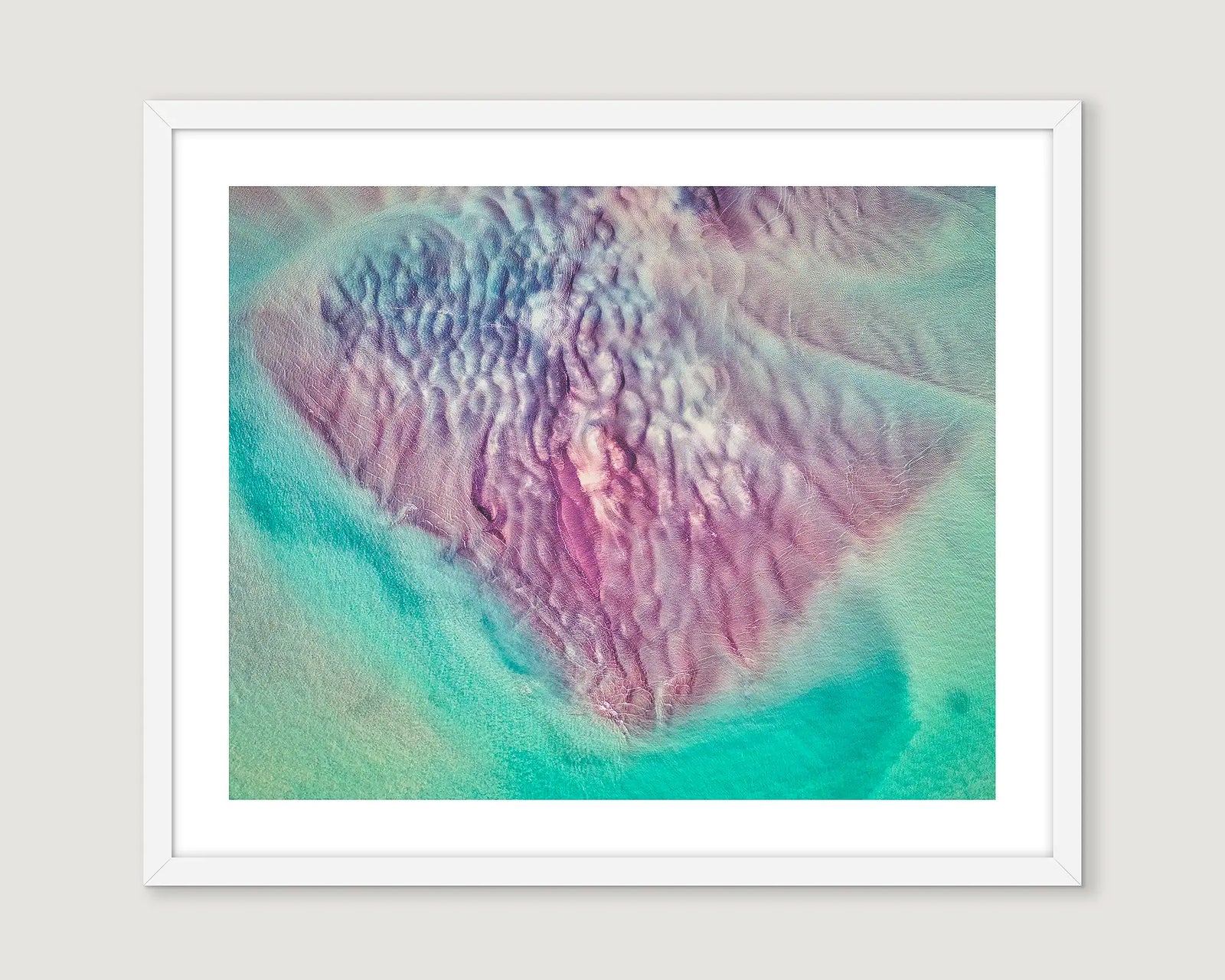 White framed artwork with a colourful abstract design.