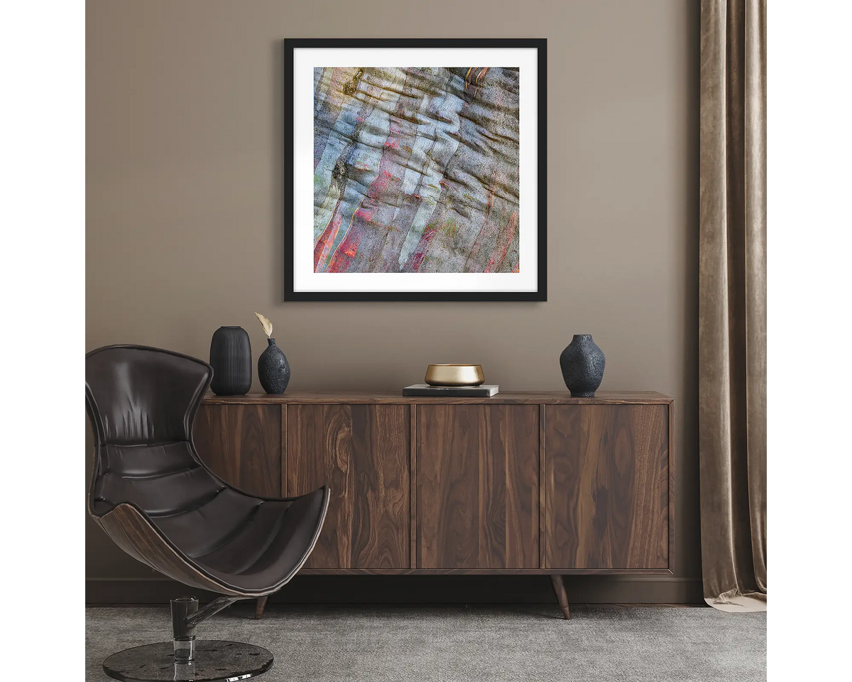 Stirling Colours. Abstract wall art print of snow gum bark on Mount Stirling, framed with a black frame and hung in a lounge room.
