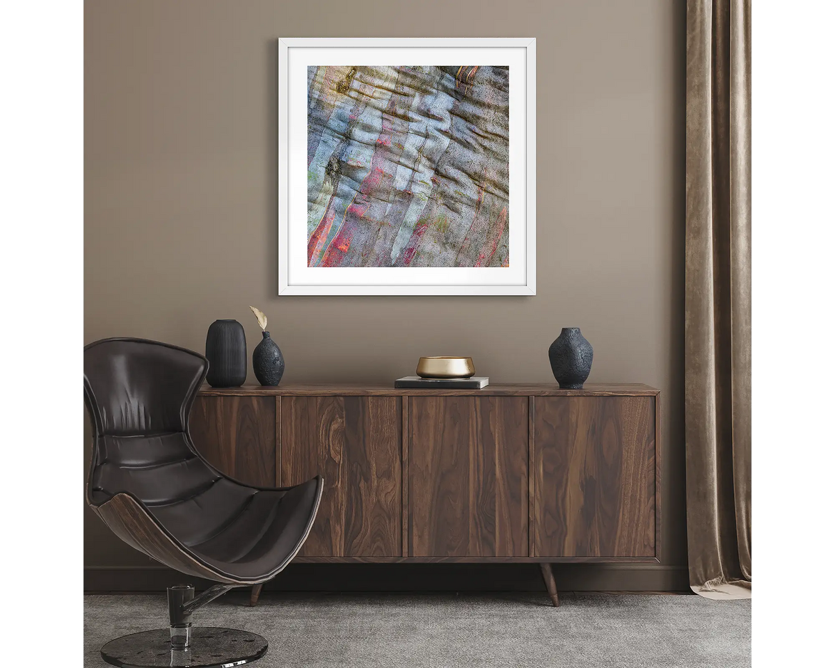 Stirling Colours. Abstract wall art print of snow gum bark on Mount Stirling, framed with a white frame and hung in a lounge room.