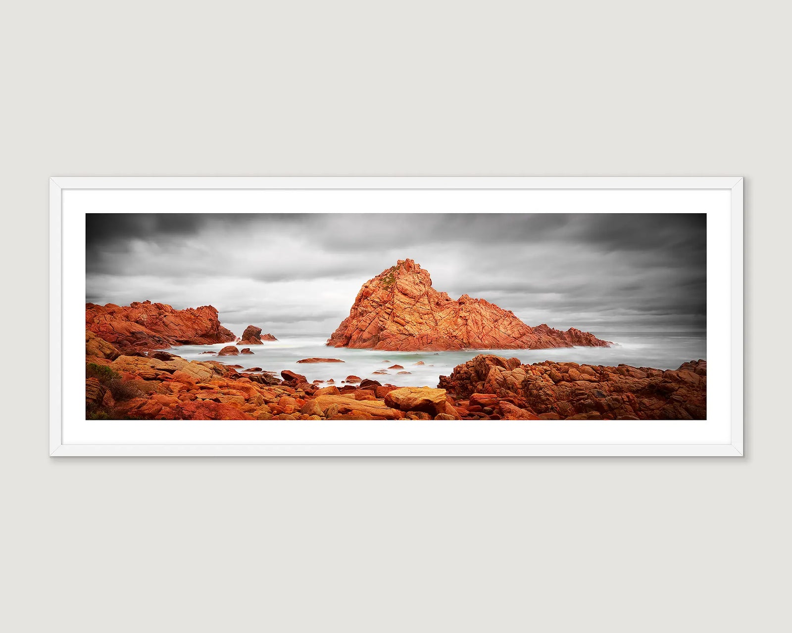 Framed landscape photograph of Sugarloaf Rock with a stormy sky and ocean.