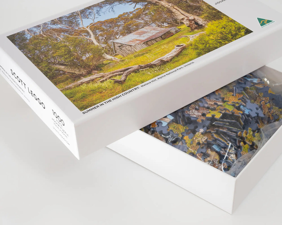Summer In The High Country 1000 piece jigsaw puzzle box lid open with puzzle pieces inside.