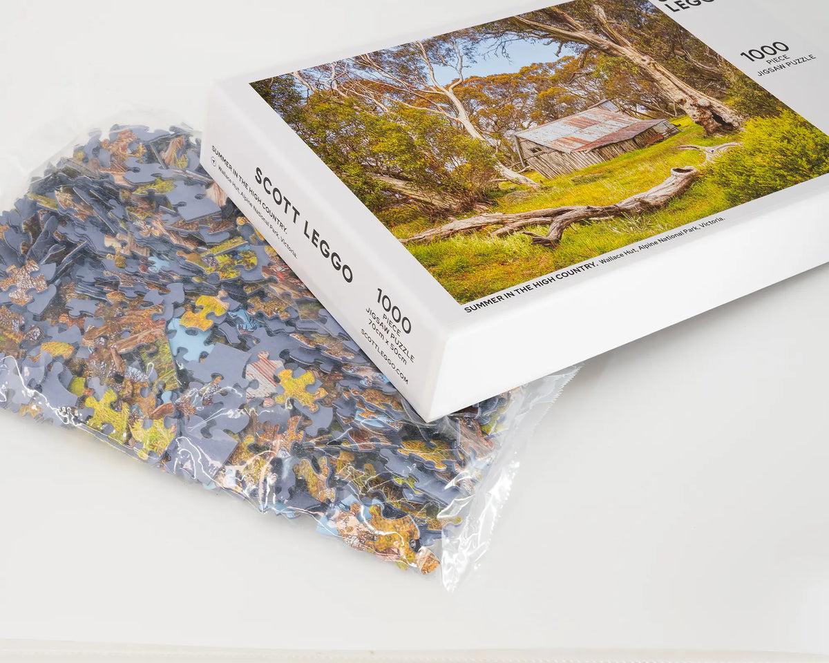 Summer In The High Country 1000 piece jigsaw puzzle box with bag of puzzle pieces.