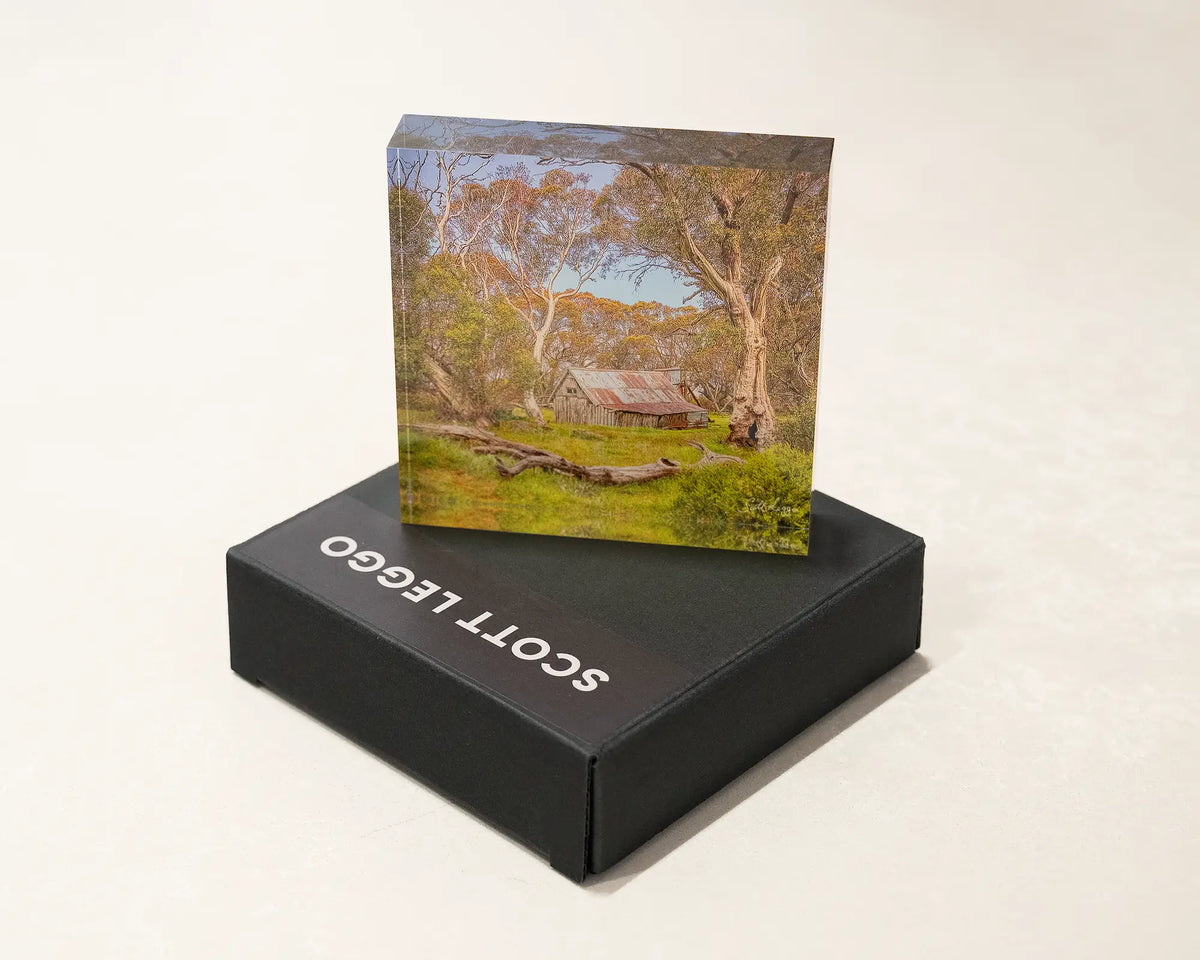Summer in the High Country. Acrylic block of Wallace Hut, Victoria placed on a gift box.