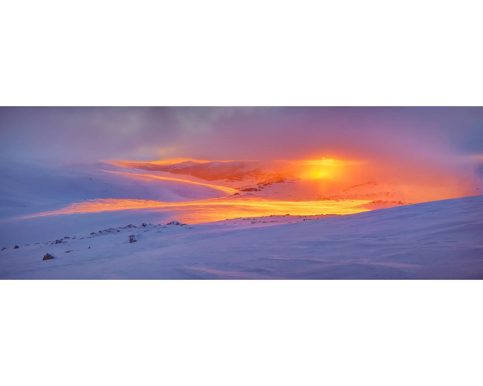 Foggy sunrise over back country snowfields in Kosciuszko National Park, NSW. 