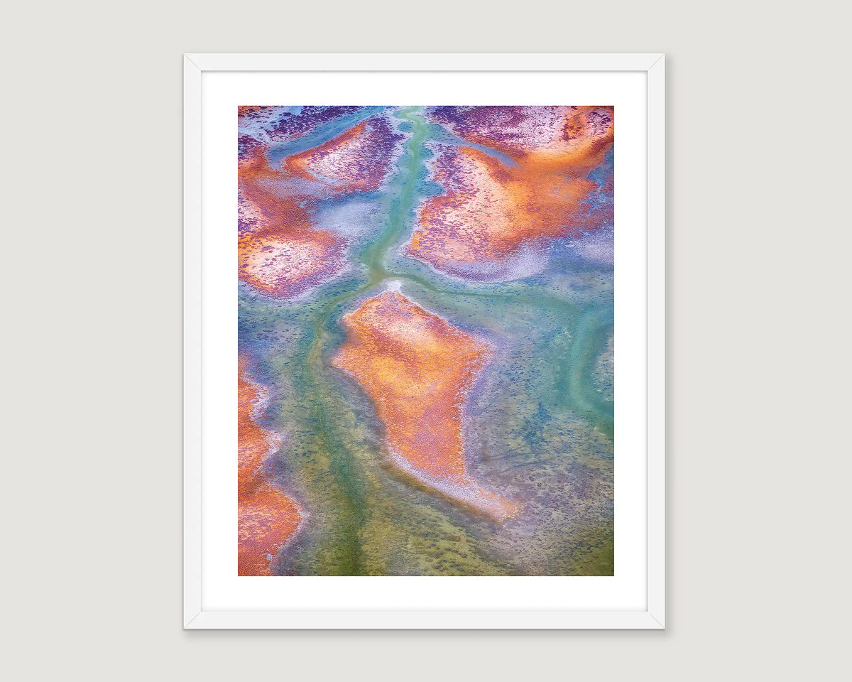 Framed abstract art print with colourful patterns on a white background.