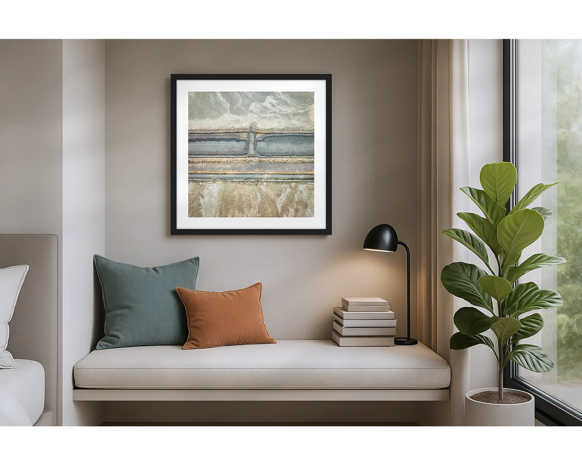 Surplus. Wall art print of an abstract scene, of a mine site from above, with a black frame, hung in an apartment. 