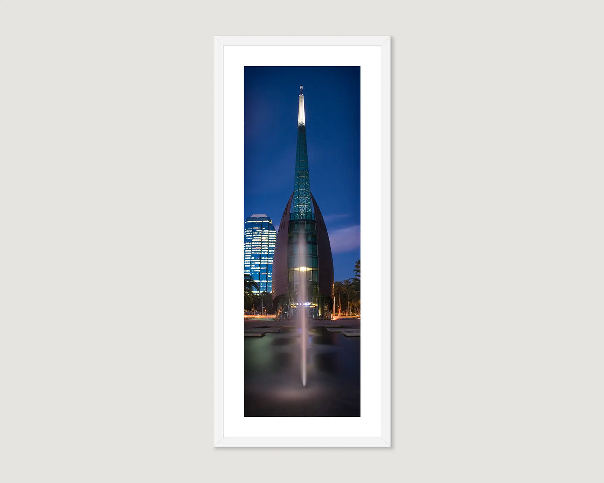 Framed photograph of a Swan Bells building with a spire against a night sky.