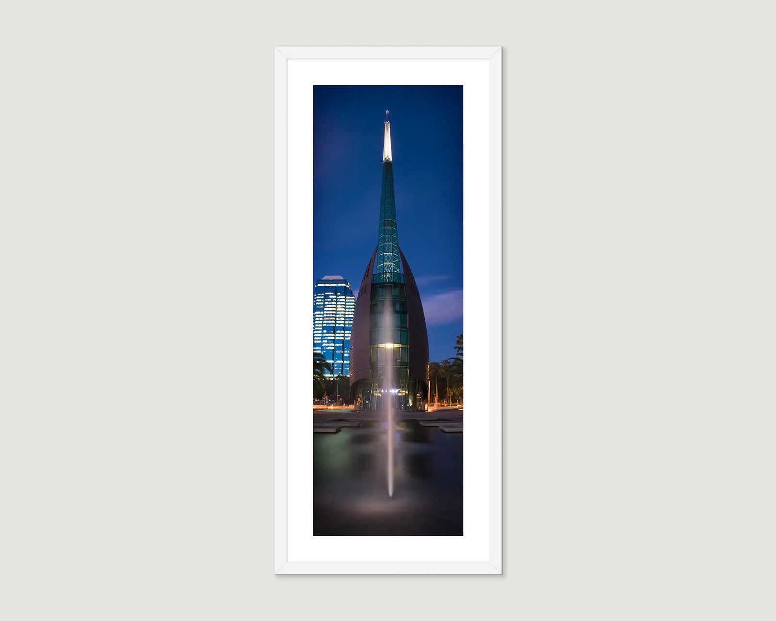 Framed photograph of a Swan Bells building with a spire against a night sky.