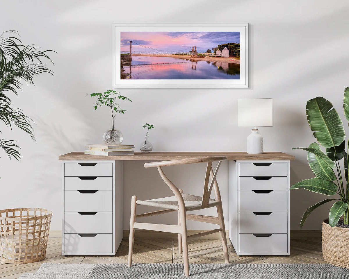 Swing Bridge. Lorne wall art print, with a white frame, hung above a small office desk.