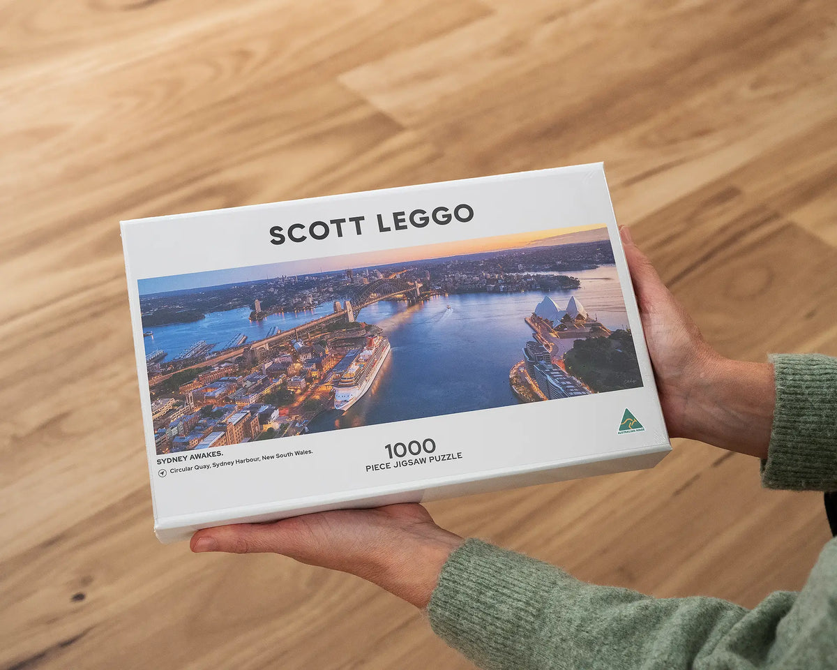 Sydney Awakes 1000 piece jigsaw puzzle being held.