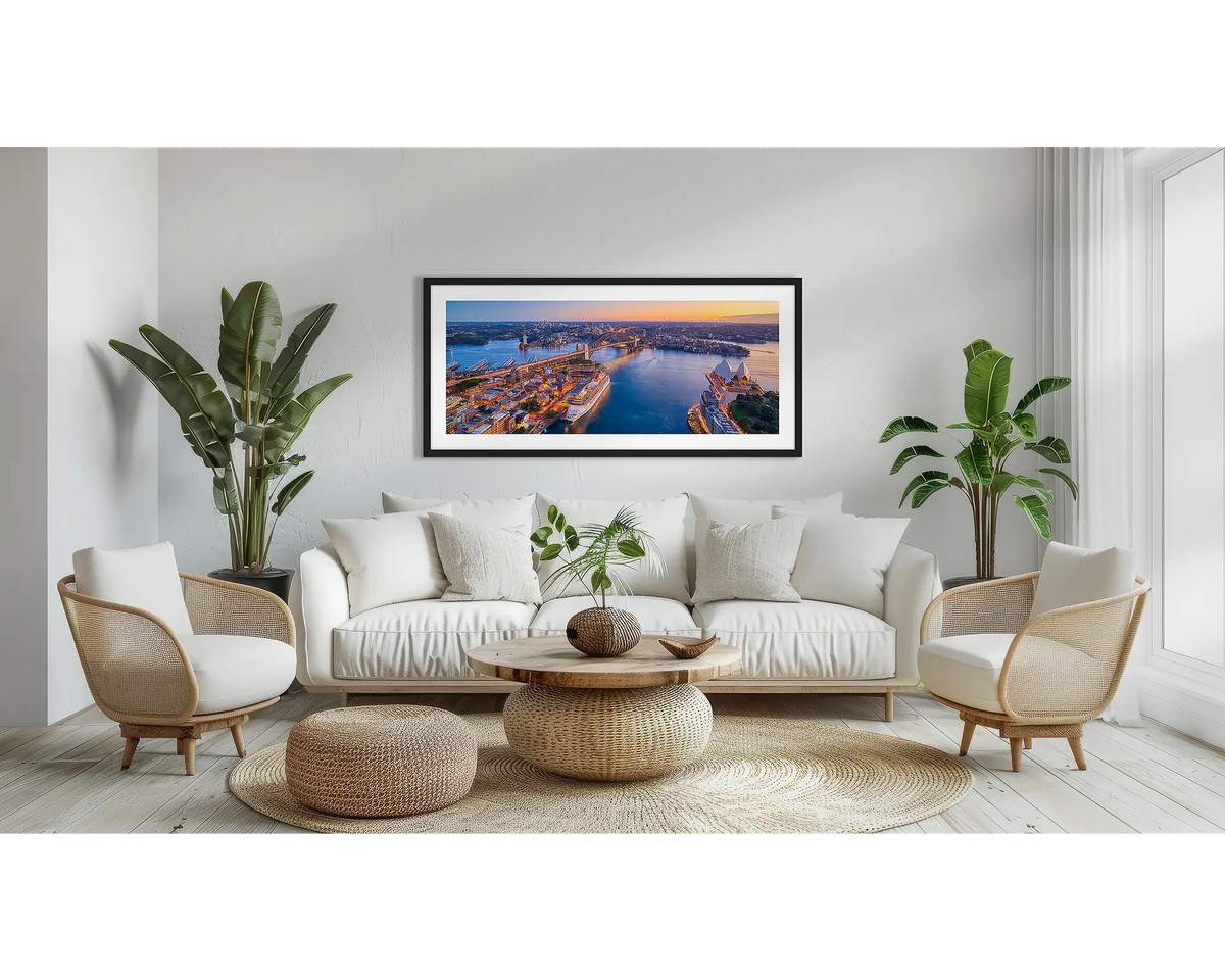 Sydney Awakes. Sydney Harbour wall art in a black frame, in a lounge room.